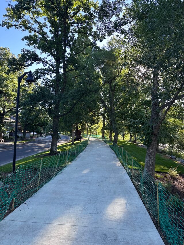Tree-lined Truckee Riverwalk path in Reno, Nevada